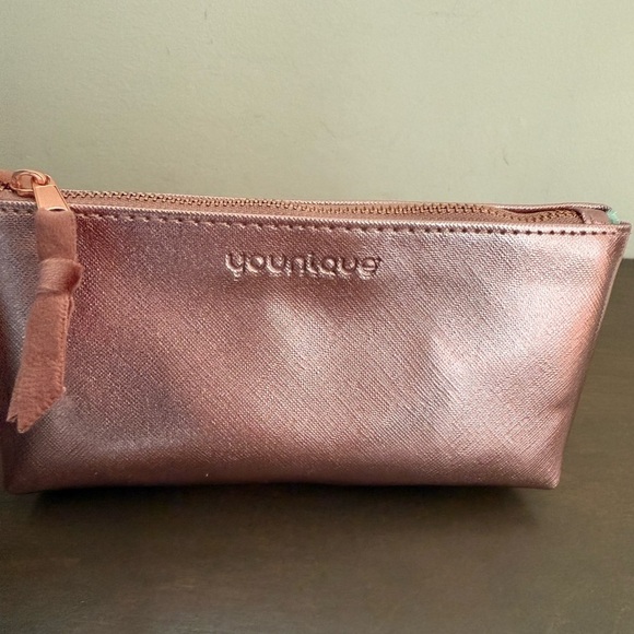Younique Handbags - Younique Rose Gold Makeup Bag with wipeable Floral interior •NIB